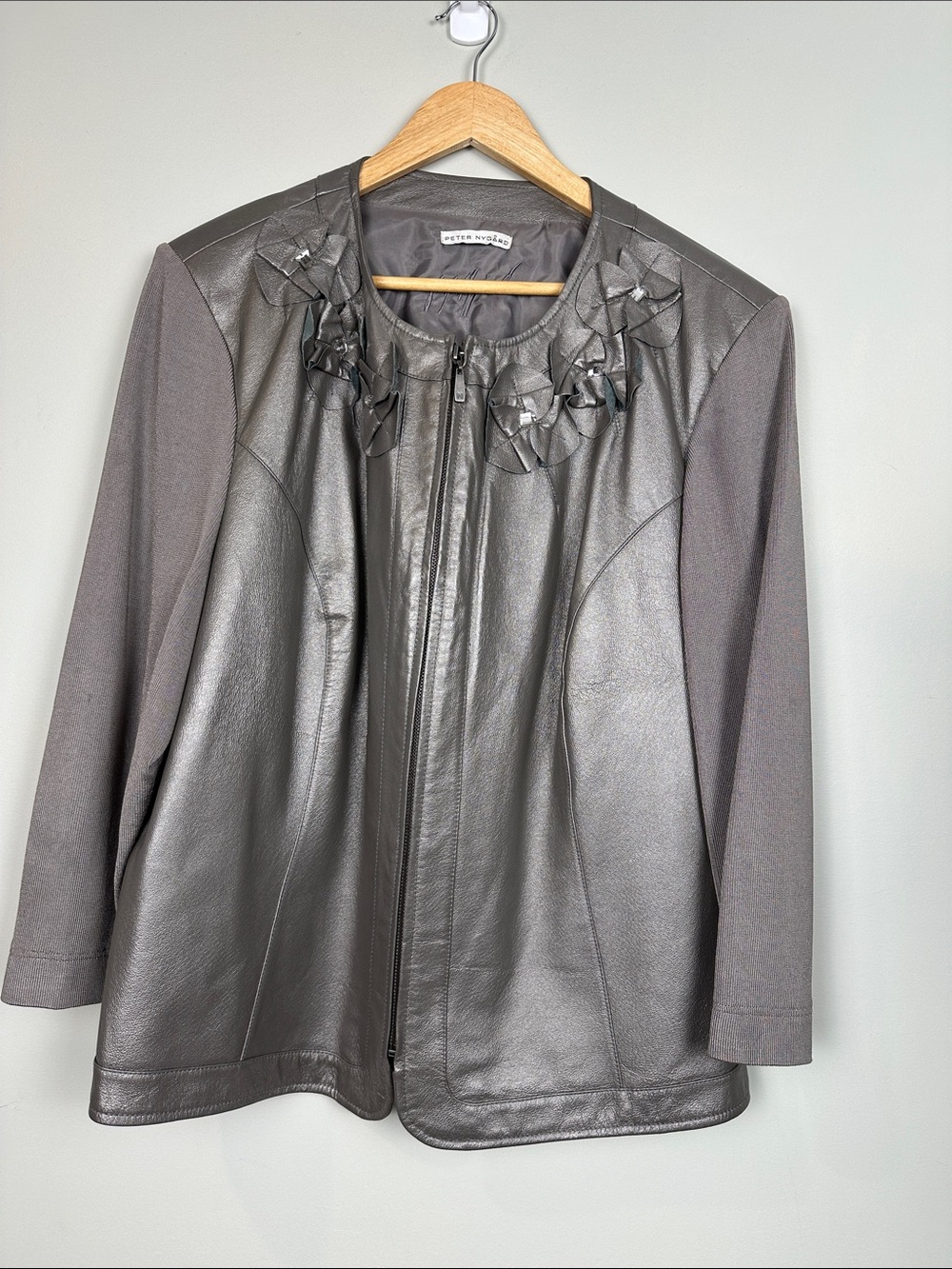 212. Peter Nygard, silver leather jacket embellished.